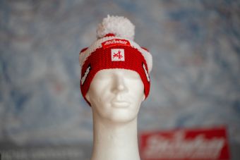 a white mannequin head with a red and white hat